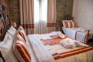 Postel nebo postele na pokoji v ubytování Hotel Restaurant Emblema