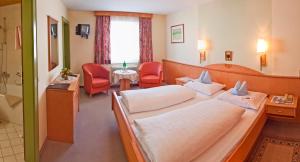Łóżko lub łóżka w pokoju w obiekcie Hotel Wagner