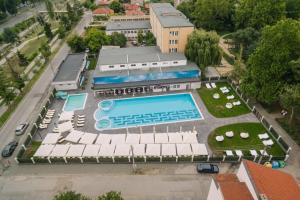 an aerial view of a building with a swimming pool at Strimon Garden Medical SPA Hotel in Kyustendil