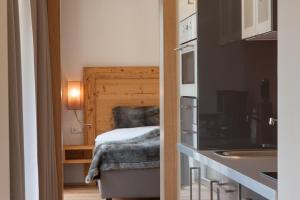 Postel nebo postele na pokoji v ubytování Hotel Garni Berghof
