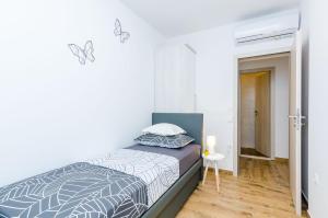 Postel nebo postele na pokoji v ubytování Apartment Moon River