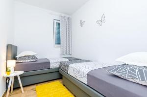 Postel nebo postele na pokoji v ubytování Apartment Moon River