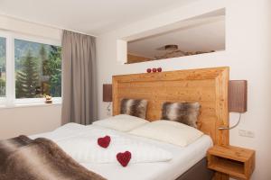 Postel nebo postele na pokoji v ubytování Hotel Garni Berghof