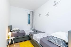 Postel nebo postele na pokoji v ubytování Apartment Moon River