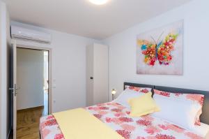 Postel nebo postele na pokoji v ubytování Apartment Moon River