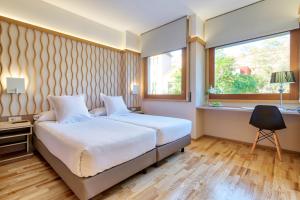 Een bed of bedden in een kamer bij Bonanova Suite