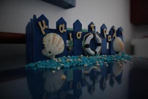 a cake with a blue fence and shells on it at Maistrali in Karavostasi