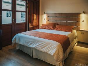 Cama o camas de una habitación en Cuenca Suites