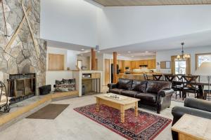 a living room with a couch and a fireplace at 3 Fir Cone Lane in Sunriver