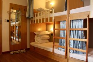 Postel nebo postele na pokoji v ubytování Travel light hostel