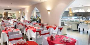 A restaurant or other place to eat at Three Corners Equinox Beach Resort