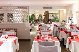 A restaurant or other place to eat at Three Corners Equinox Beach Resort