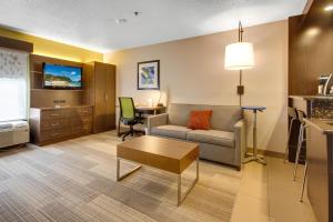 a living room with a couch and a table at Holiday Inn Express Dublin, an IHG Hotel in Dublin