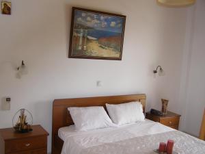Łóżko lub łóżka w pokoju w obiekcie Evridiki Apartments