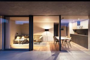 a rendering of a living room and dining room at Marchegg Apartments in Naturno
