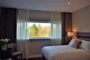 Ліжко або ліжка в номері The Birches Killarney