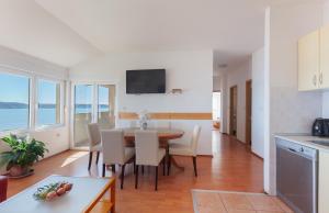 Kuchyň nebo kuchyňský kout v ubytování Apartmani Panorama + 17 fotografií