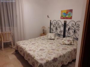 A bed or beds in a room at playa mar 2