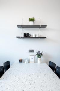 a conference room with a table with chairs and plants at HSA - Shoreditch in London