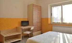 Tempat tidur dalam kamar di Residence Chiara
