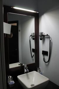 Koupelna v ubytování Hotel Concorde