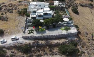 an aerial view of a house on a hill at Kalados Studios in Kalando