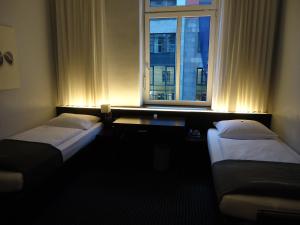 Postel nebo postele na pokoji v ubytování Hotel Concorde