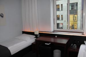 Postel nebo postele na pokoji v ubytování Hotel Concorde