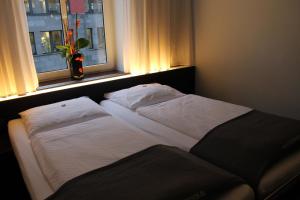 Postel nebo postele na pokoji v ubytování Hotel Concorde