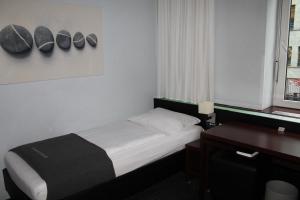 Postel nebo postele na pokoji v ubytování Hotel Concorde