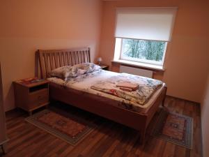 Кровать или кровати в номере Auksinė Avis