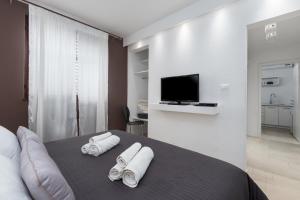 A bed or beds in a room at Apartments and rooms Villa Bori