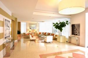 a living room with a couch and a table at Pestana South Beach Hotel in Miami Beach