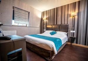 Postelja oz. postelje v sobi nastanitve Hôtel d'Orléans