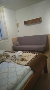 Postel nebo postele na pokoji v ubytování Guest House Kovalik