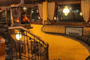 a group of benches in a room with a yellow wall at Grand Hotel Sestriere in Sestriere