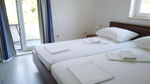 Кровать или кровати в номере Guest House Kukuljica 2