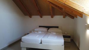 Кровать или кровати в номере Guest House Kukuljica 2