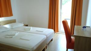 Кровать или кровати в номере Guest House Kukuljica 2