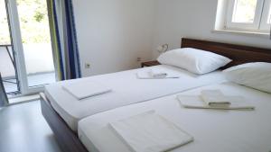 Кровать или кровати в номере Guest House Kukuljica 2