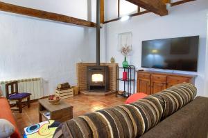 A television and/or entertainment centre at Cuencaloft Alfonso VIII
