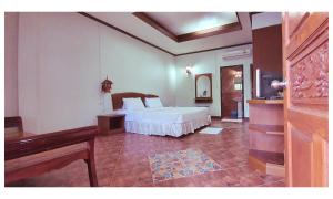 TAWAN RESORT客房内的一张或多张床位