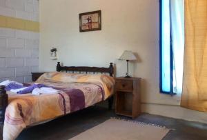 Una cama o camas en una habitación de Hosteria Aura Azul (ex Ser Azul)