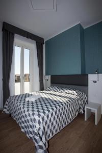 Postel nebo postele na pokoji v ubytování Guesthouse Porto di Roma