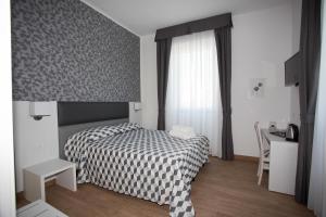 Postel nebo postele na pokoji v ubytování Guesthouse Porto di Roma