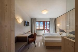 Postel nebo postele na pokoji v ubytování Hotel Garni Pirchhütt