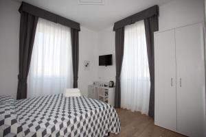 Postel nebo postele na pokoji v ubytování Guesthouse Porto di Roma