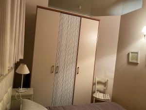 a bedroom with a large closet with a mirror at Casa Rural Marín in Hecho