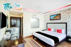 Postel nebo postele na pokoji v ubytování Sea Shell Beach Cottages & Suites