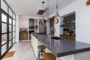 a kitchen with a large black counter top in a room at Casa Higueras in Moclín